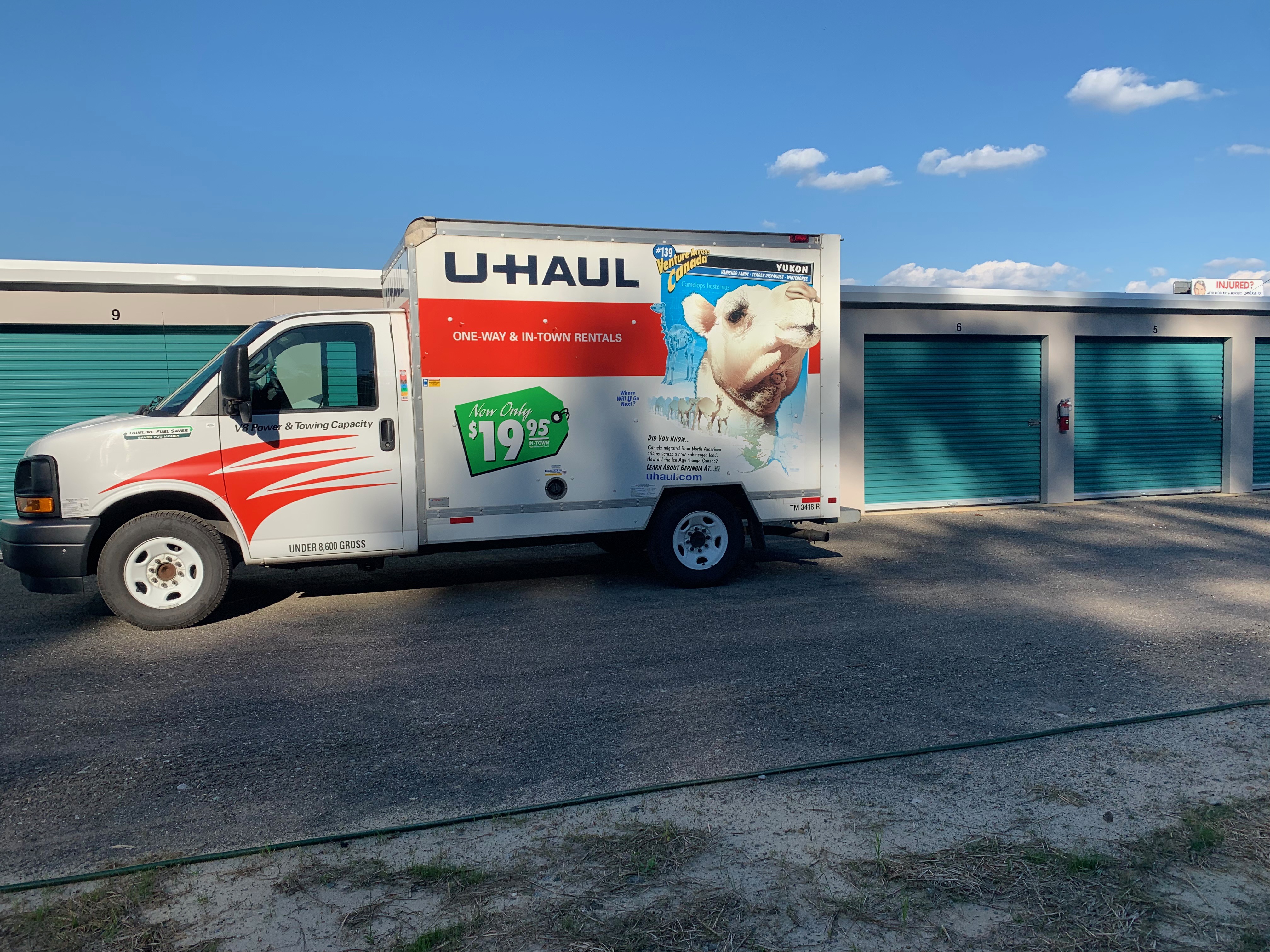 uhaul moving truck parked in front of drive up access storage units